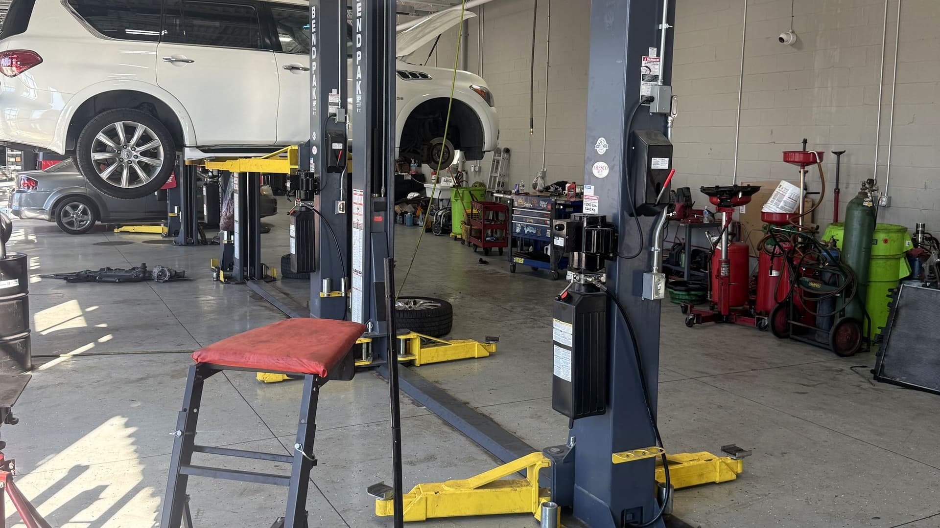 Service bays with two-post lifts at Redford Auto Repair on Telegraph Road